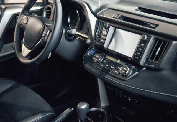 Luxury car Interior - steering wheel, shift lever, dashboard and computer.